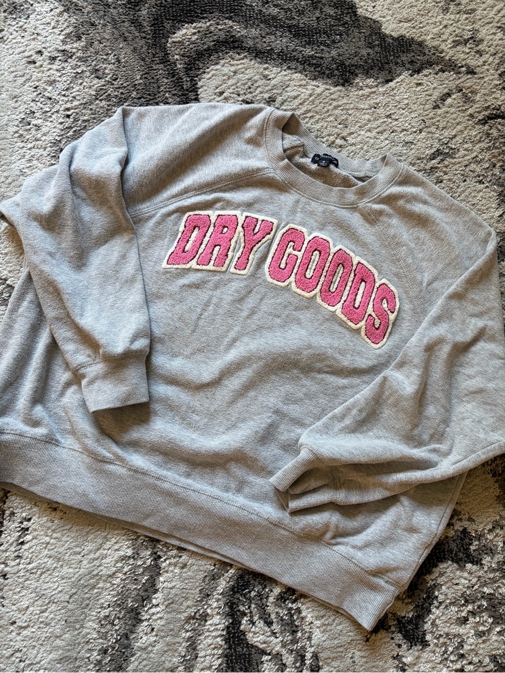Dry Goods Women’s Gray Crewneck Sweater with Pink Logo